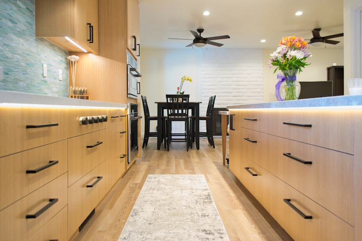 Custom wood kitchen cabinetry with island and integrated storage