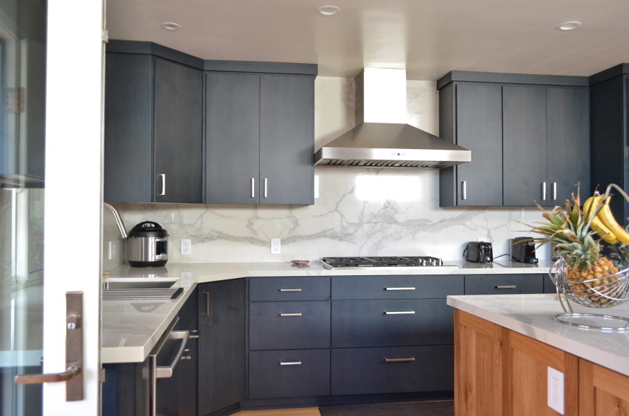 Finished custom cabinetry and range wall