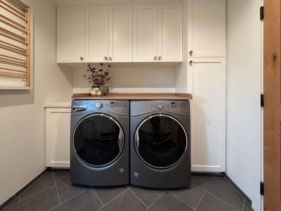 Laundry room cabinetry and storage around washer and dryer